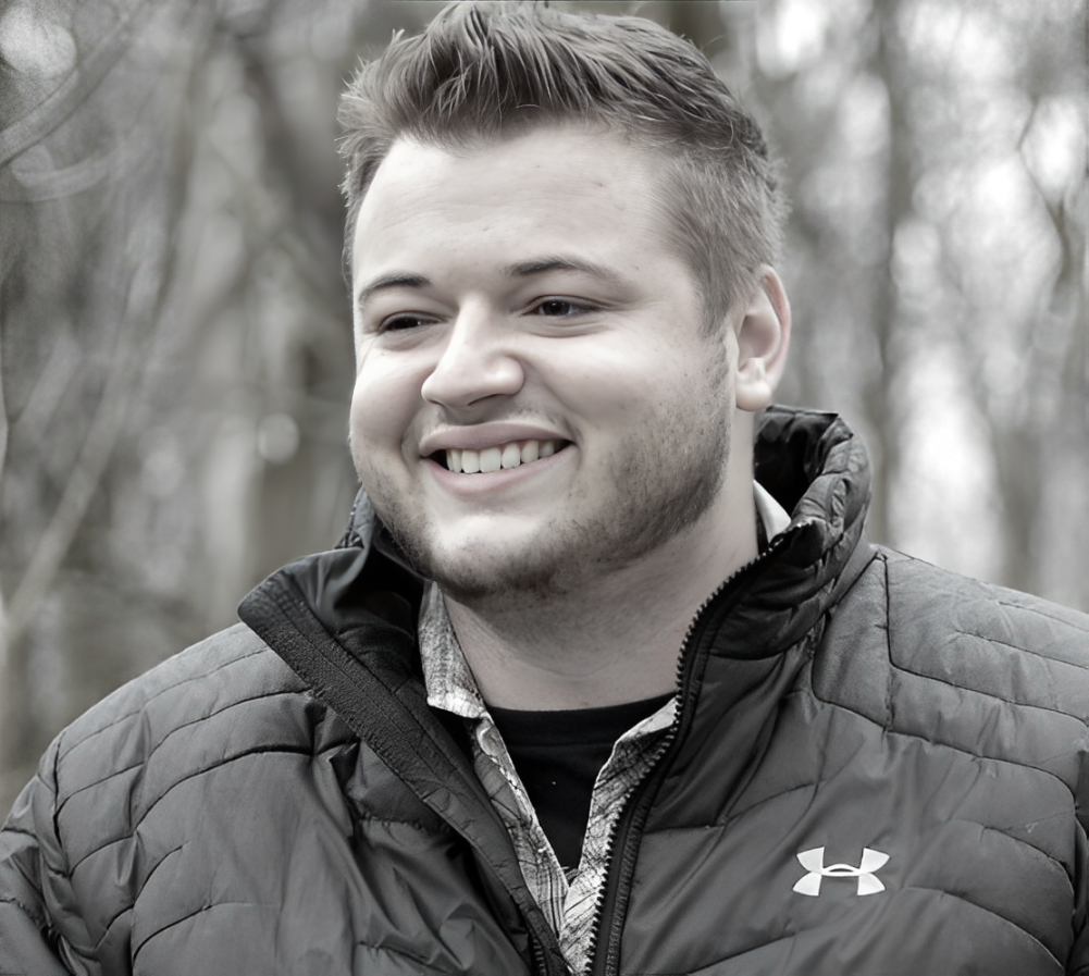 man wearing a jacket smiling