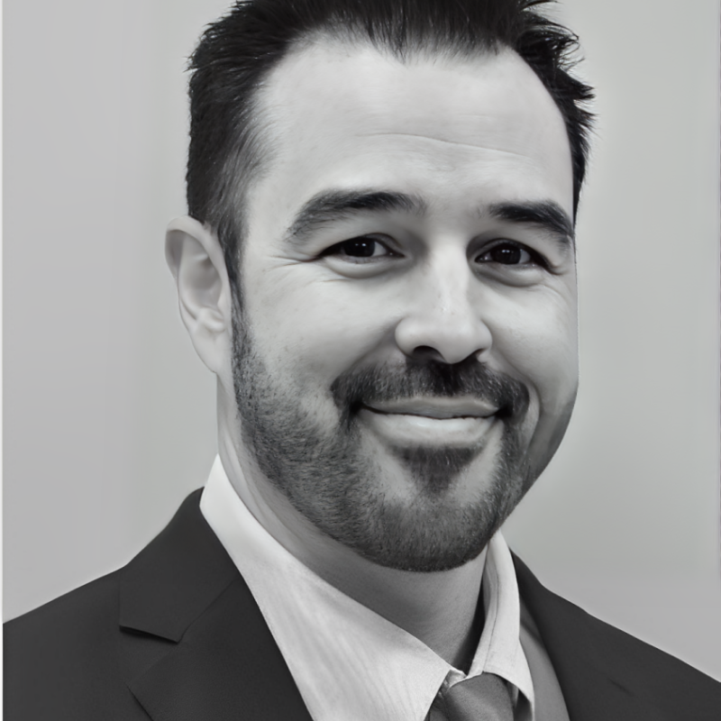 portrait of male with beard wearing suit