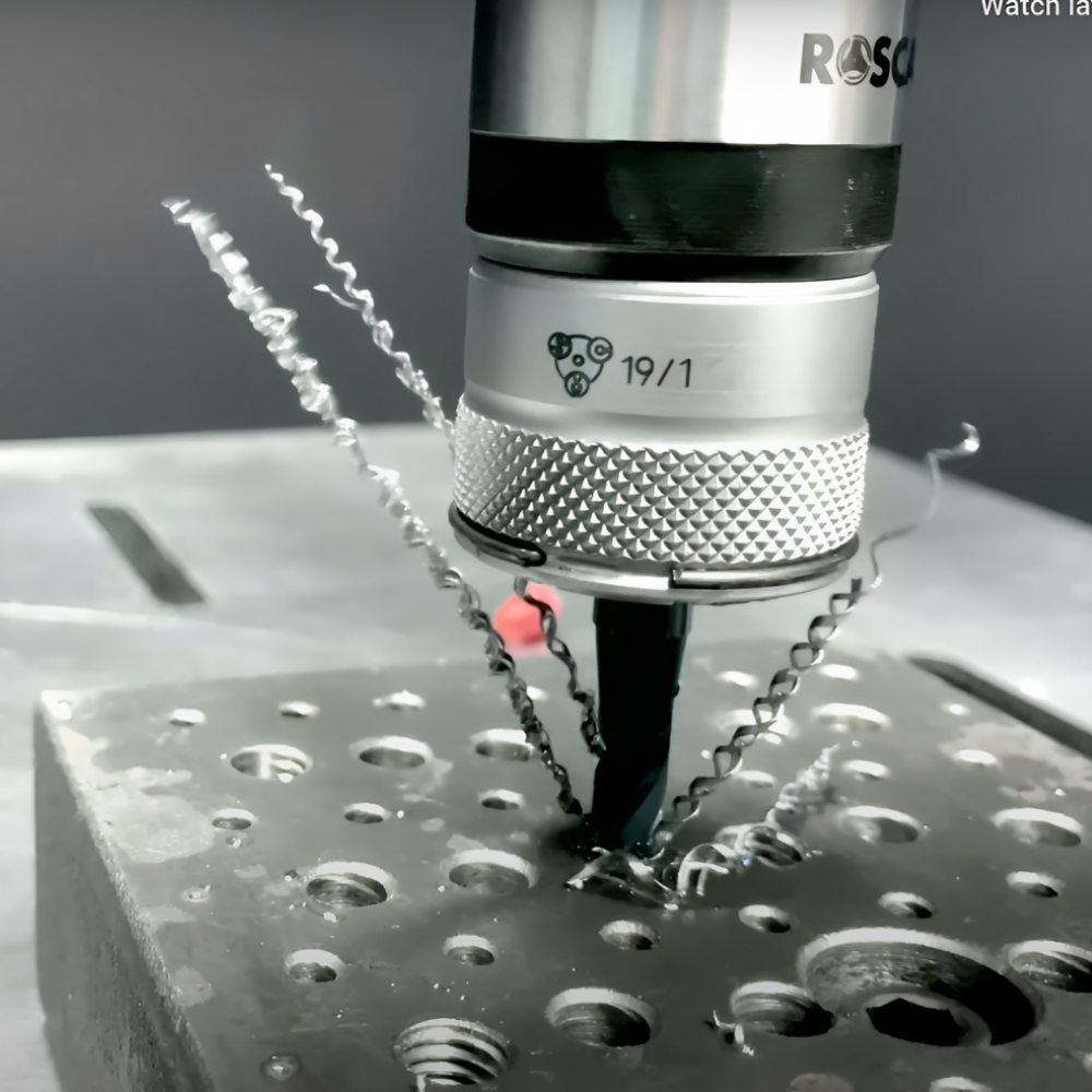 Roscamat®USA tapping arm's precision engineering on display as it effortlessly taps a perfectly threaded hole in a metal component.